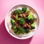 A mouthwatering close-up of beef and broccoli, showcasing tender beef slices and vibrant green florets.