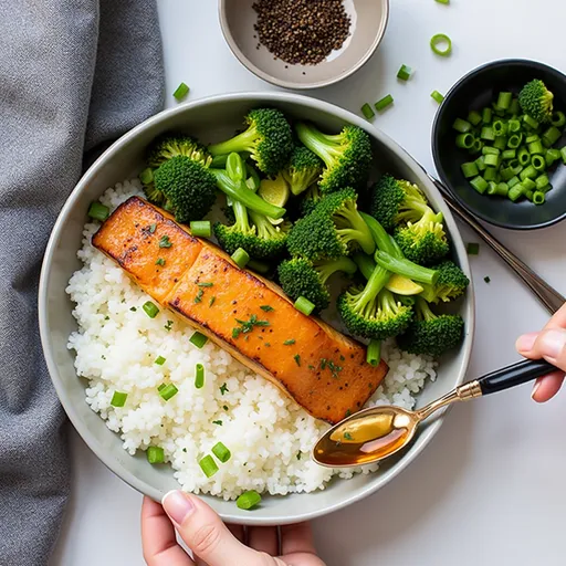 The Sweet and Savory Salmon That’ll Steal Your Heart Close-up of a beautifully glazed Air Fryer Honey Garlic Salmon on a white plate, garnished with green onions and lemon wedges.