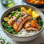 Close-up of a Healthy Sweet Chili Salmon Bowl featuring salmon, brown rice, steamed broccoli, and colorful vegetables.
