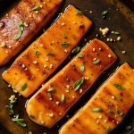 Close-up of Honey Garlic Glazed Salmon fillet with glistening glaze.
