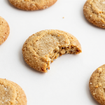 Close-up of brown sugar cookies on a wood table.
