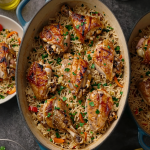 Chicken and rice dish on a plate.