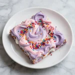 Colorful yogurt bark shaped like a unicorn, a favorite treat for toddlers and kids.