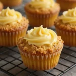 Delicious Keto Pumpkin Cheesecake Muffins with a creamy filling displayed on a wooden table