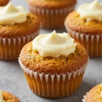 Delicious Keto Pumpkin Cream Cheese Muffins on a rustic wooden table