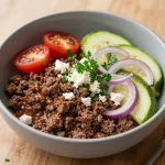 A colorful Mediterranean ground beef stir-fry served in a bowl with fresh vegetables